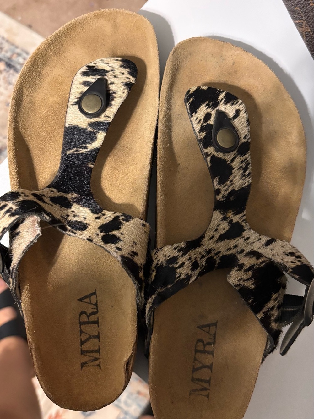 Myra Bag Cow -Print Toe-Post Sandals in Black & Cream